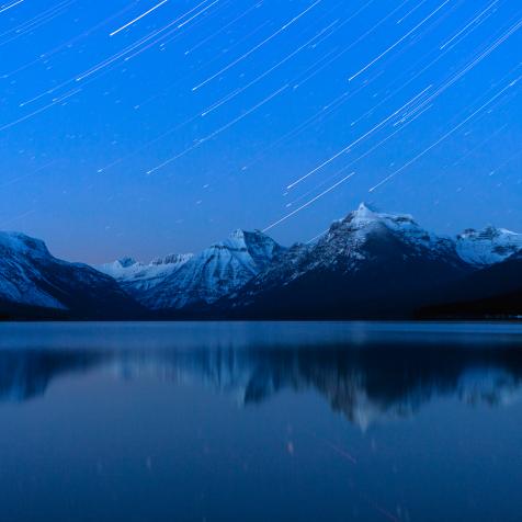 Star trails over Lake McDonald in mid winter in Glacier National Park, Montana.